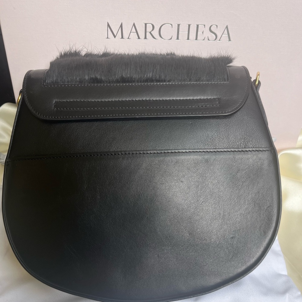 Marchesa black fur purse.